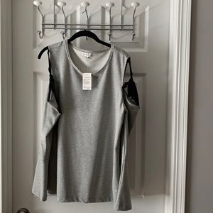 Neiman Marcus - cool looking top. Open cut sleeves with ribbon.